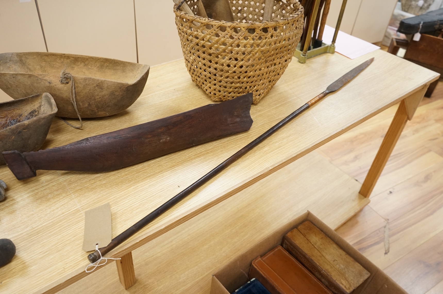Tribal interest; A collection of various African carvings, a basket and spear